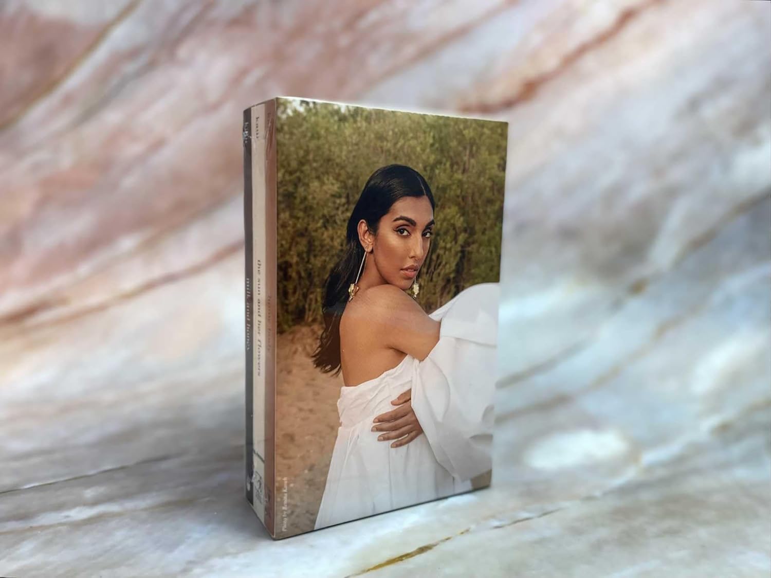 Rupi Kaur poetry book cover shown in aesthetic background setting – lifestyle view