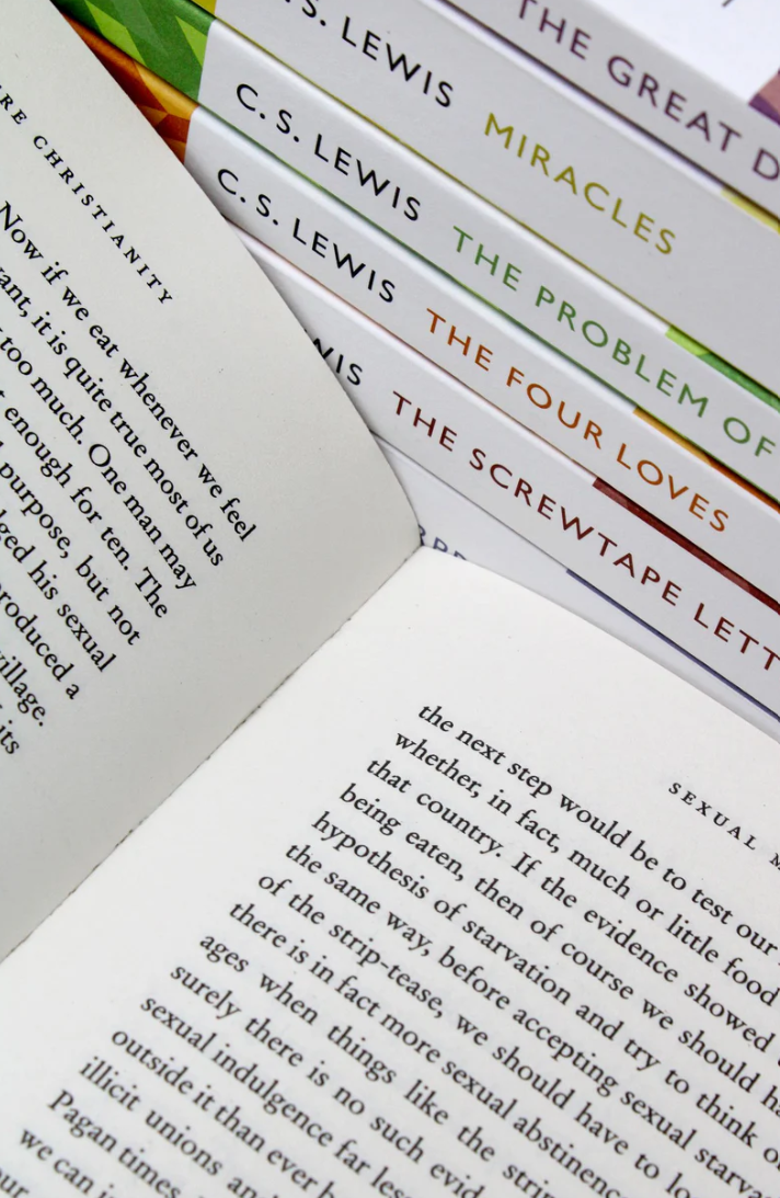 Stack of C. S. Lewis books from The Complete Signature Classics Box Set, including The Great Divorce, Miracles, The Four Loves, and The Screwtape Letters.