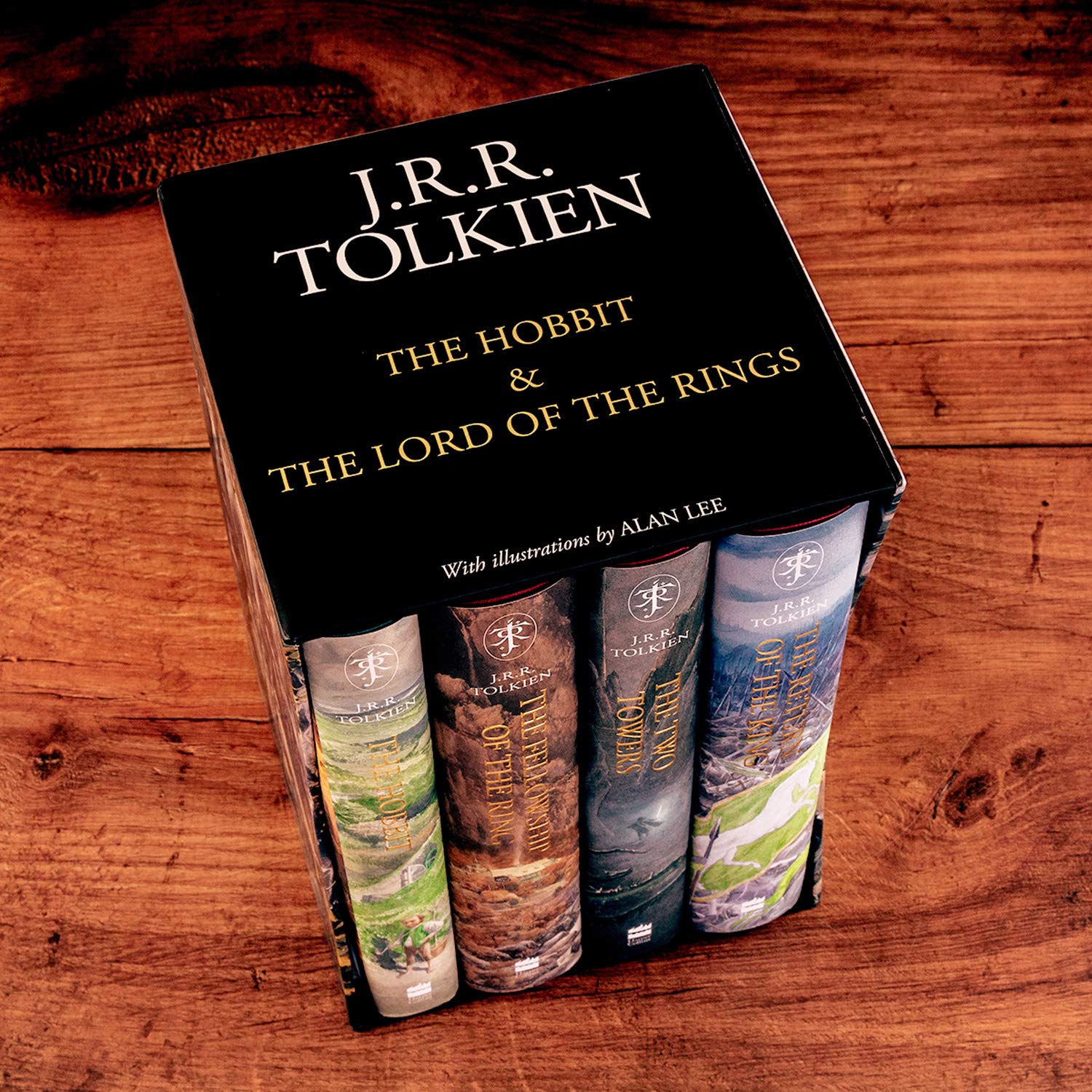Top view of the illustrated Tolkien box set featuring all four spines and a black lid with gold lettering.