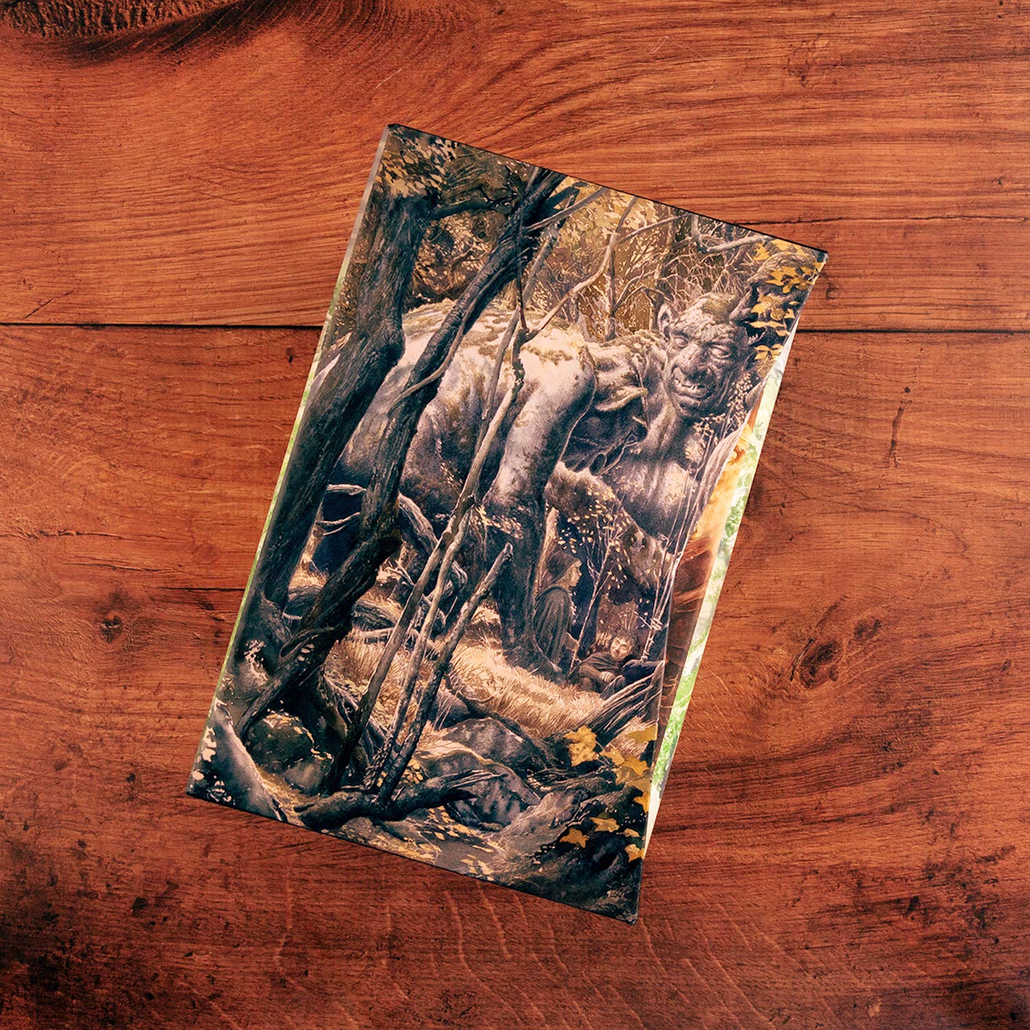 Front cover illustration of The Lord of the Rings featuring a troll in a dense forest, illustrated by Alan Lee.