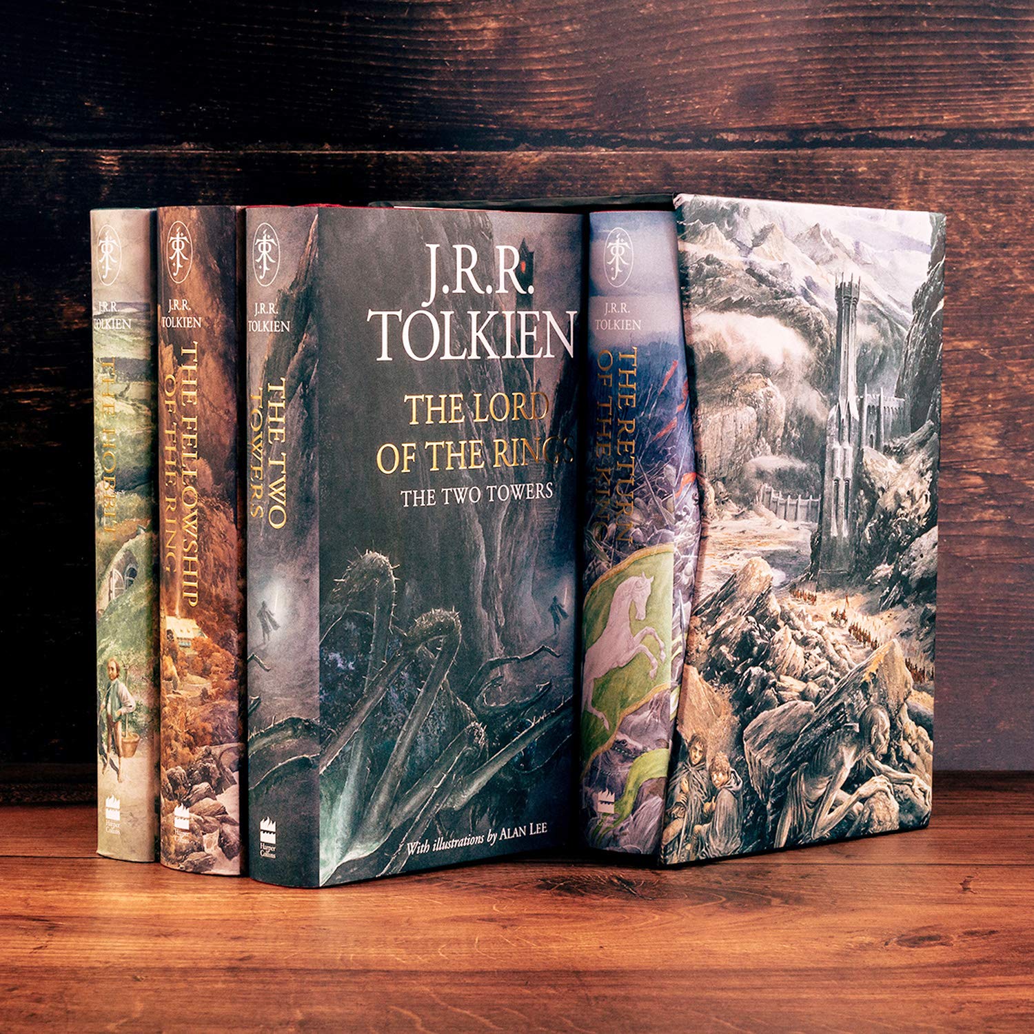 Full display of The Hobbit and The Lord of the Rings books with detailed illustrated covers by Alan Lee.