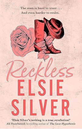 Book cover of 'Reckless' by Elsie Silver with pink boots and rose on a light background