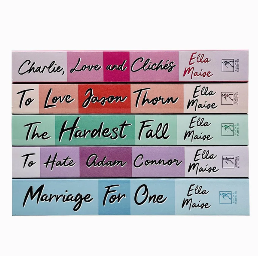 Collection of books by Ella Maise with colorful spines on a white background