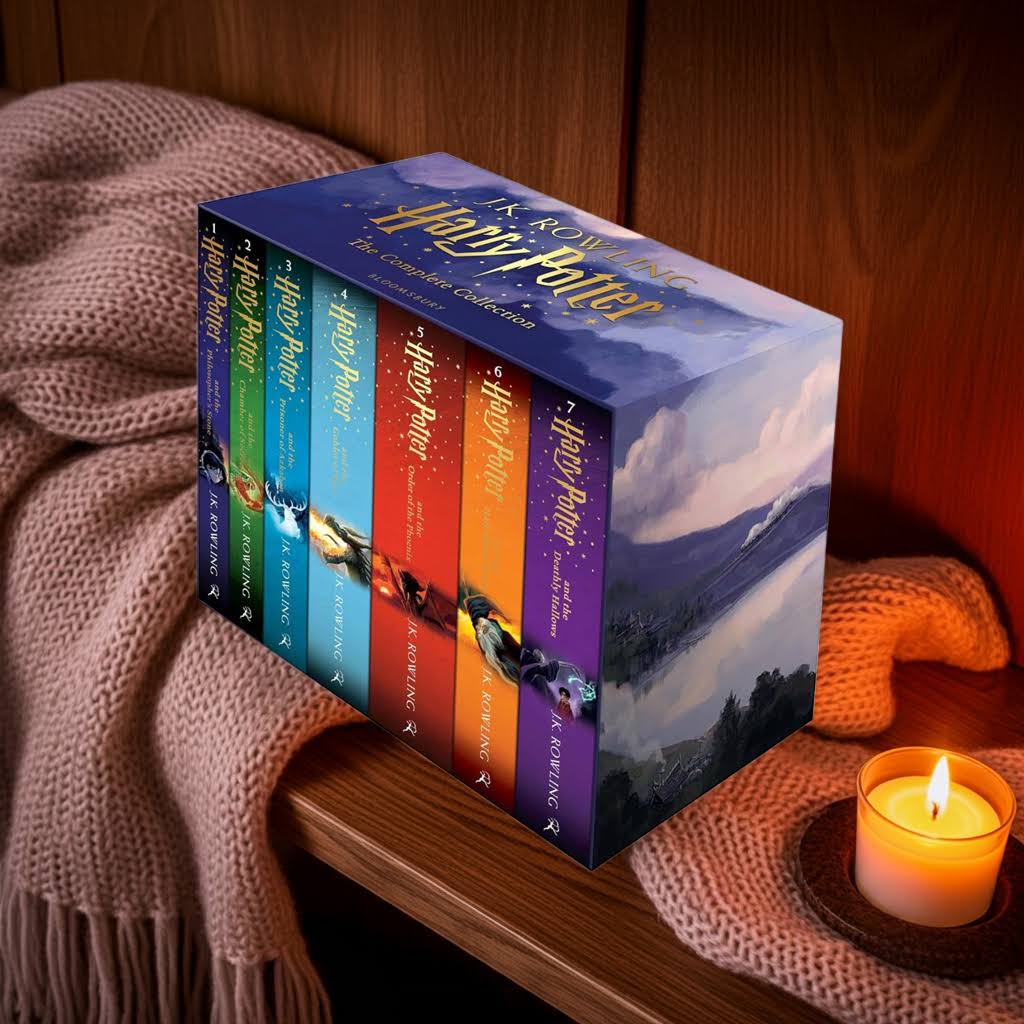 Harry Potter book set on wooden shelf with candle and warm blanket