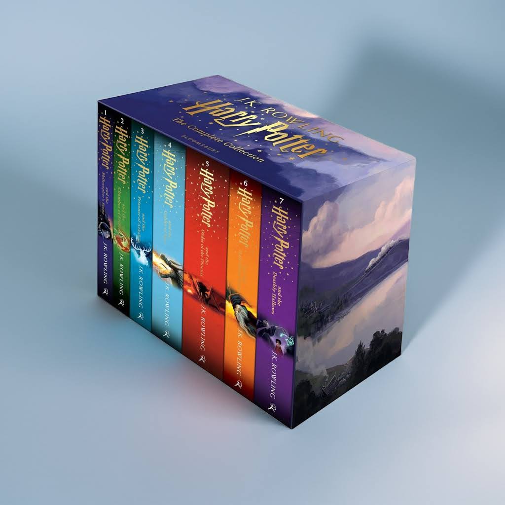 Harry Potter box set standing on light blue background with soft shadows