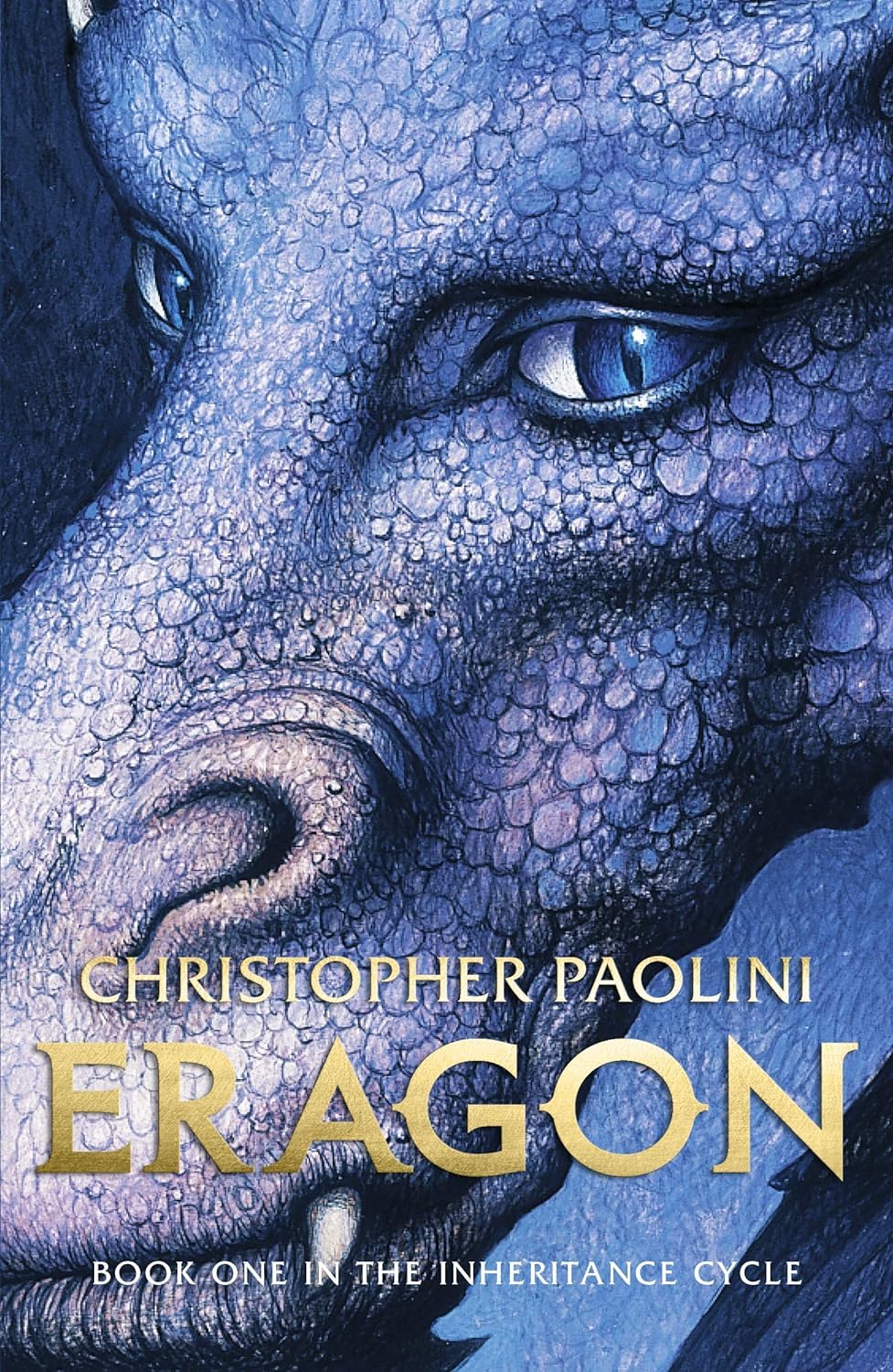 Book cover of 'Eragon' by Christopher Paolini featuring a dragon's face.