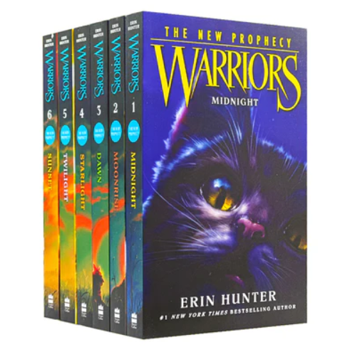 Set of 'Warriors' books by Erin Hunter with a prominent cover featuring a cat's face.