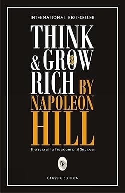 Cover of the book 'Think and Grow Rich' by Napoleon Hill, featuring title text in bold, capital letters over a dark background, with a tagline 'The Secret to Freedom and Success' and a label indicating the classic edition.