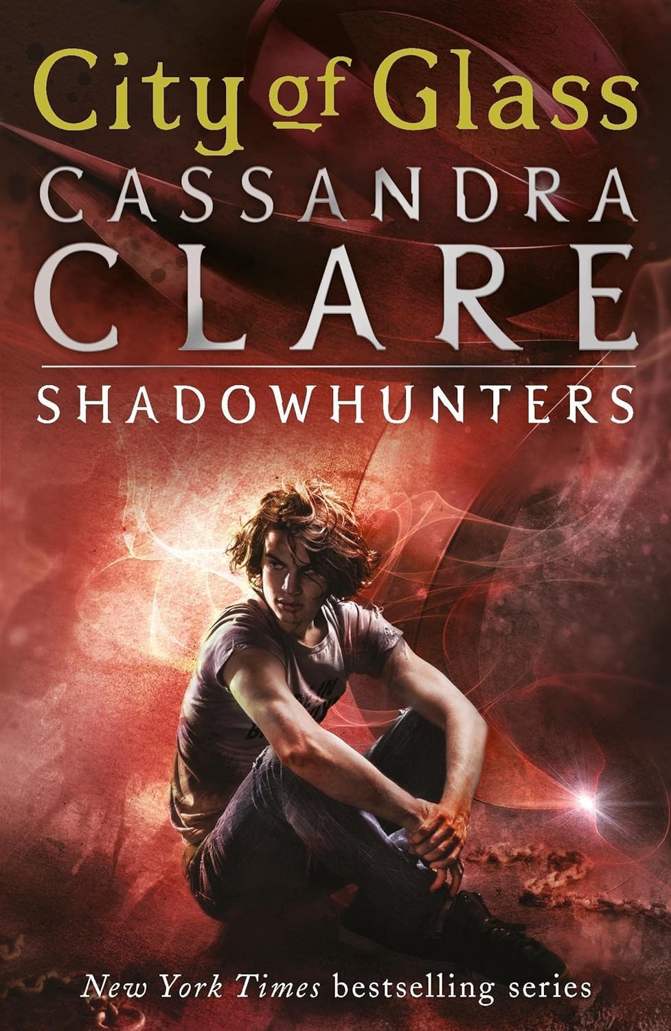 Book cover of 'City of Glass' by Cassandra Clare featuring a character in a dramatic pose.