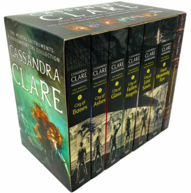 Collection of books by Cassandra Clare with prominent display on a box.