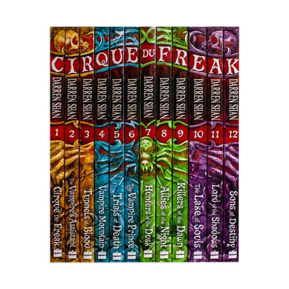 A set of 12 graphic novel books from the 'Darkness Rising' series by Sarah Pinney, displayed vertically side-by-side on a plain white background.