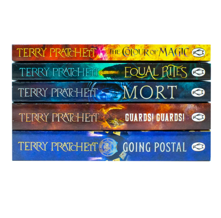 Stack of books by Terry Pratchett on a white background
