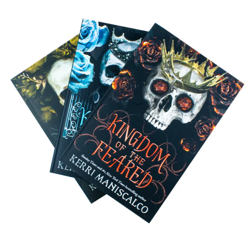 Book titled 'Kingdom of the Feared' by Kerri Maniscalco with skull and rose design on cover