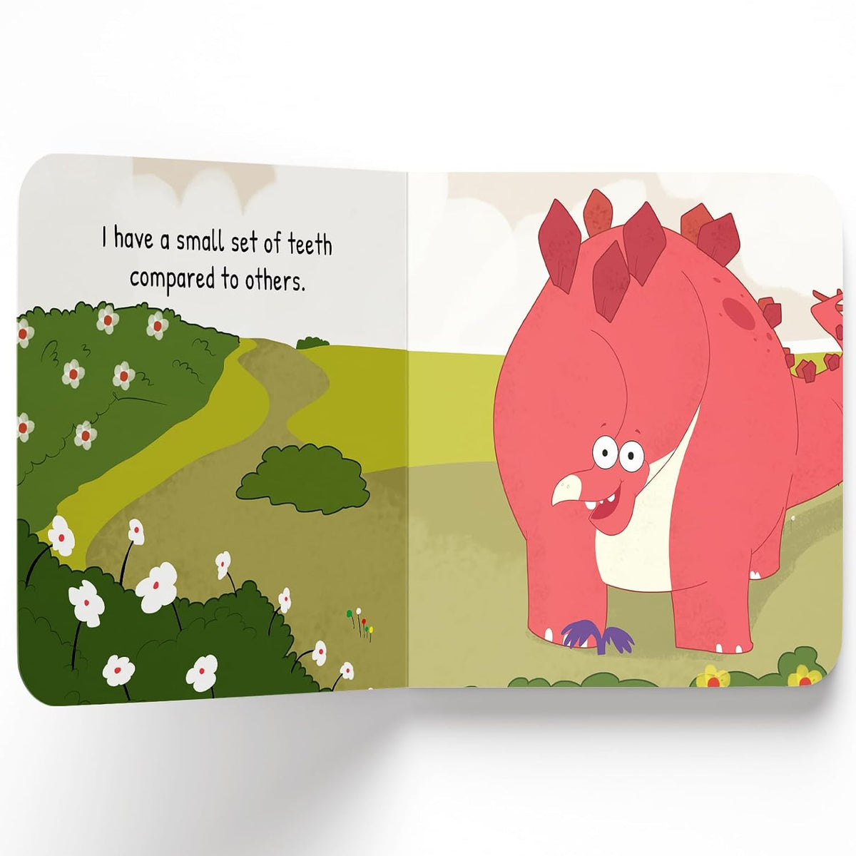 An open children's book spread showing a pink cartoon dinosaur on the right page with the text 'I have a small set of teeth compared to others.' on the left page, against a clean white background.