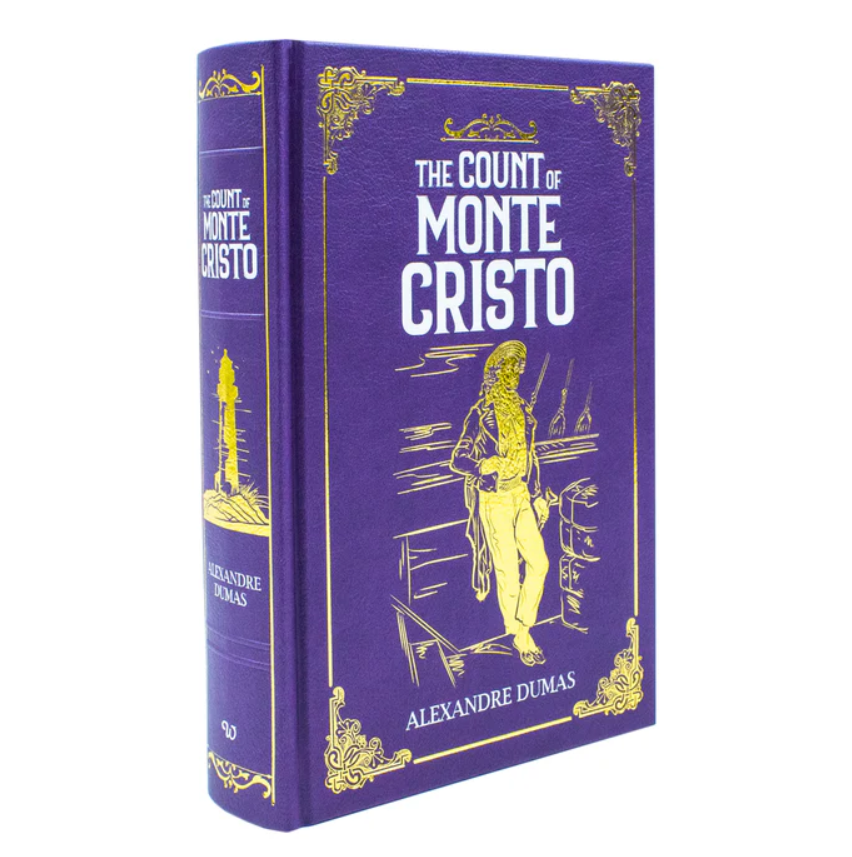 Purple book cover of 'The Count of Monte Cristo' with gold illustrations and text.