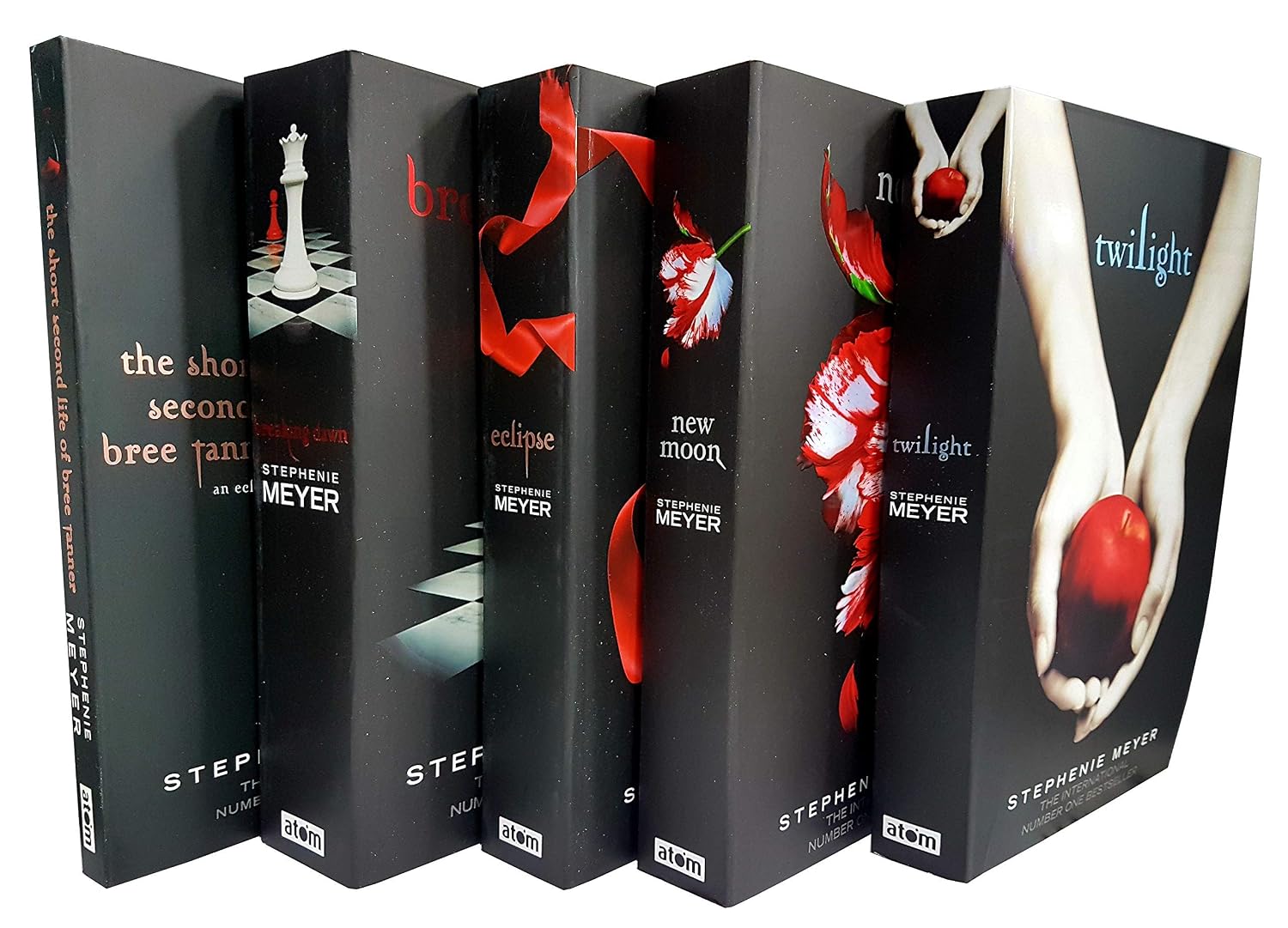 Five hardcover books from The Twilight Saga series arranged in a fan-like display against a white background. The spines and covers are predominantly black with red, white, and gray accents, featuring titles including The Shadow of the Vampire, Bree, Eclipse, New Moon, and Twilight.