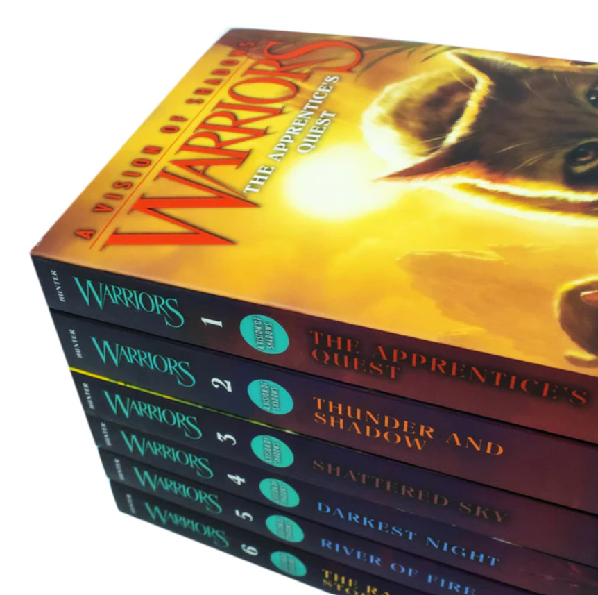 Set of 'Warriors' books with colorful covers on a white background