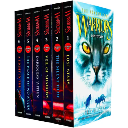 Set of 'Warriors' books with a prominent cover featuring a cat's face.